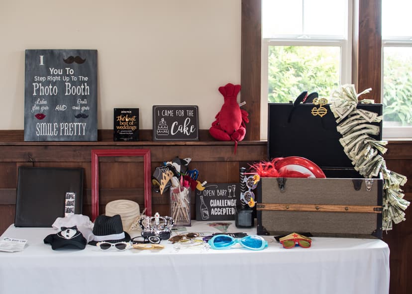 Guests using fun photo booth props