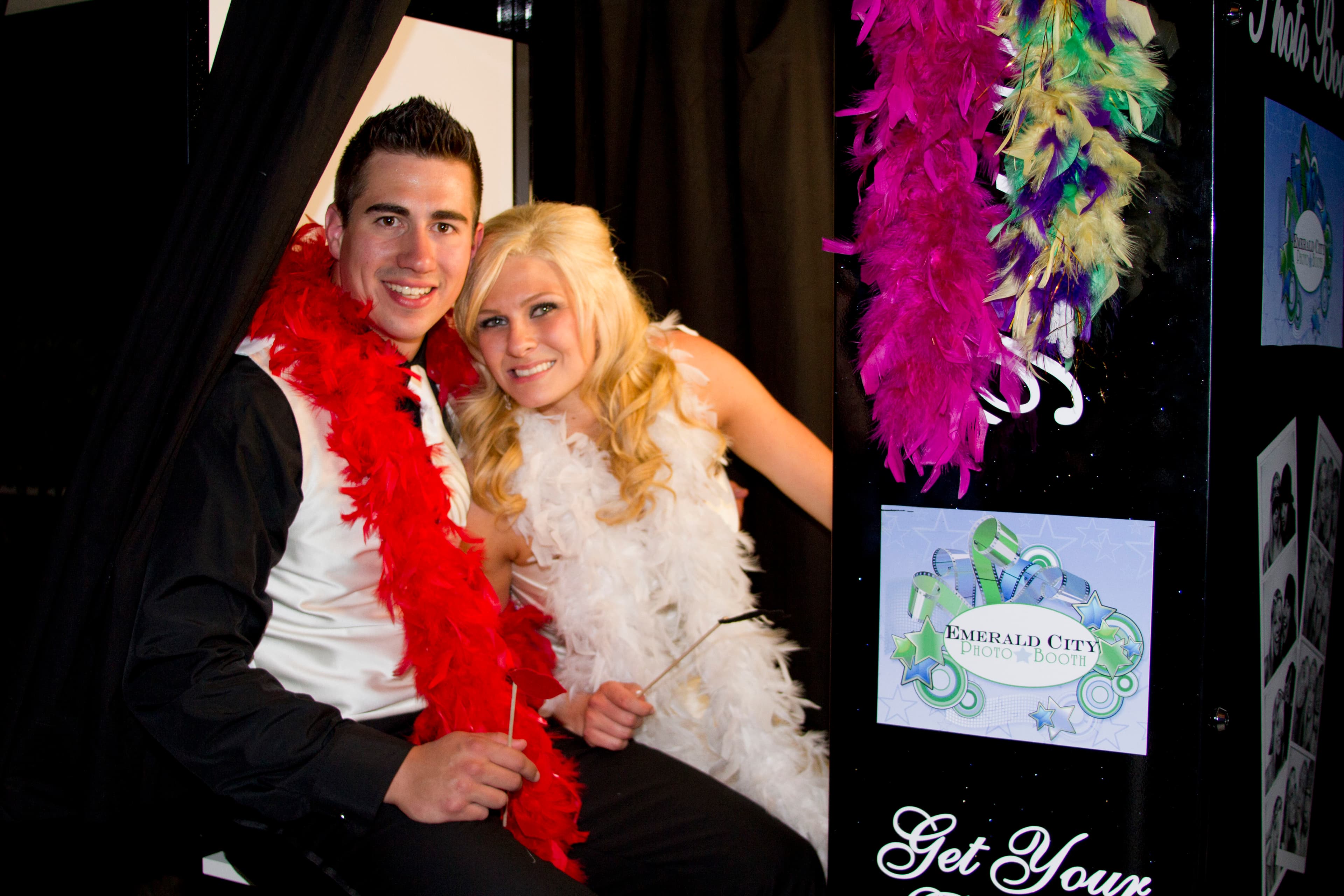 A couple enjoying a photo booth experience at their wedding